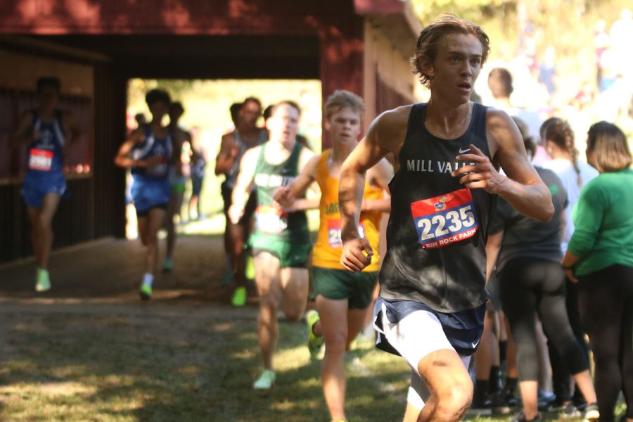 As he passes Kings Bridge on Rim Rock Farm, sophomore Carter Cline looks ahead at the steep hill just meters away from the finish line.