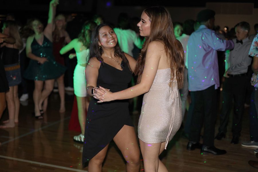 While holding hands, juniors Mia Hernandez and Jenna Kingsbury dance with each other. 