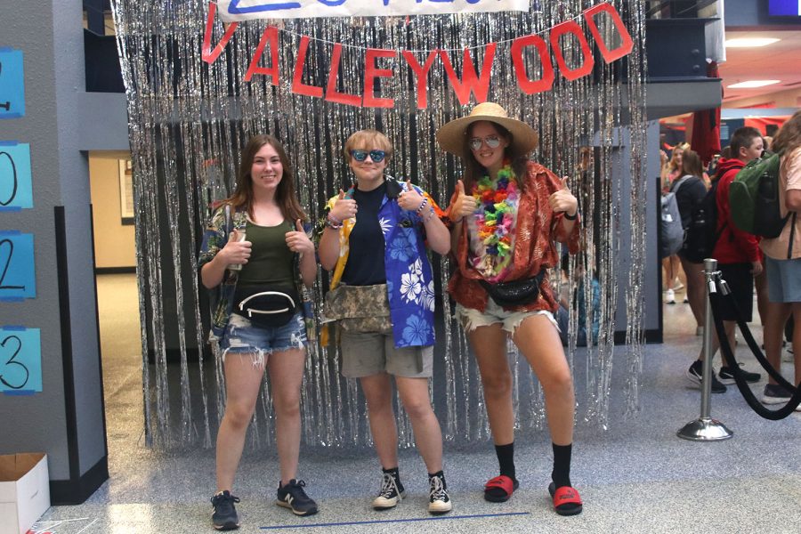 With thumbs up, sophomore Piper Wendler and juniors Kai Tolly and Elle Wheelock pose for a picture.