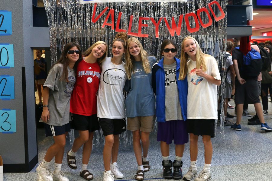 Smiling at the camera, sophomores rock Adam Sandler day with their oversized t-shirts and long shorts.
