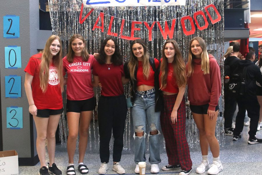 Gathered in front of the Valleywood sign, juniors show off their class color of red.