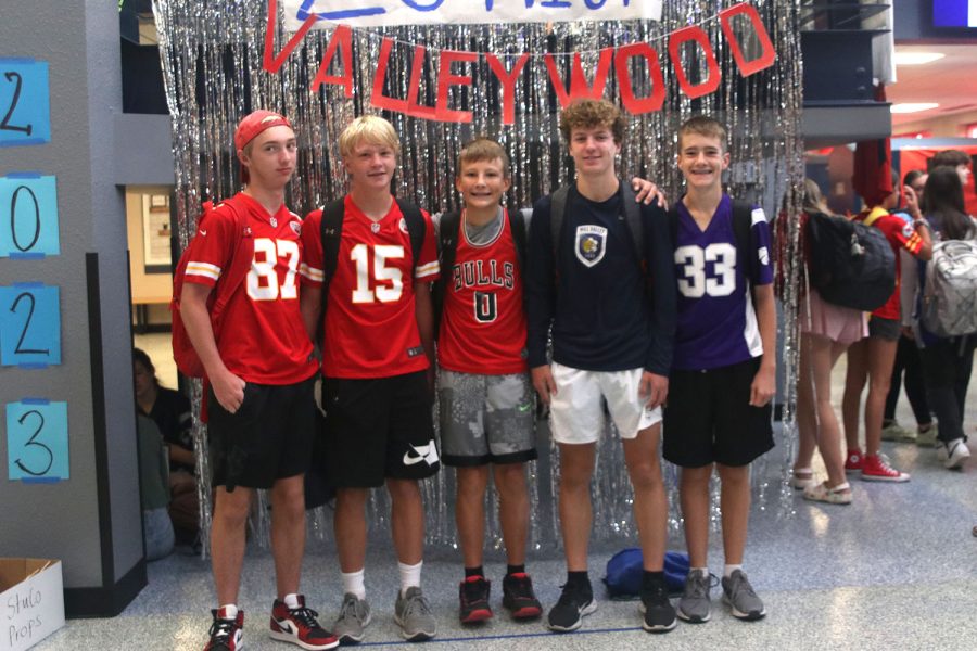Gathered together, a group of freshmen boys pose in their jerseys on Waterboy day.