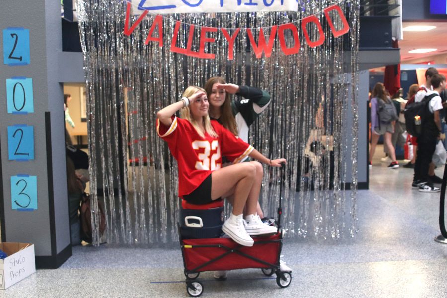 Posing by their wagon full of water, juniors Taylor Hey and Molly Bilhimer show off their best Waterboy outfits.