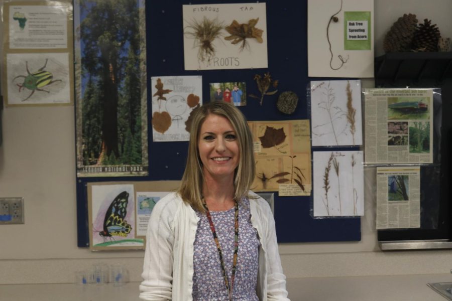 Standing proudly in front of her wall, Kelly Prickett enjoys these walls saying  I really love all the like insects that have been collected over the years by the students. I just thought that was really neat how it was displayed and collected.
