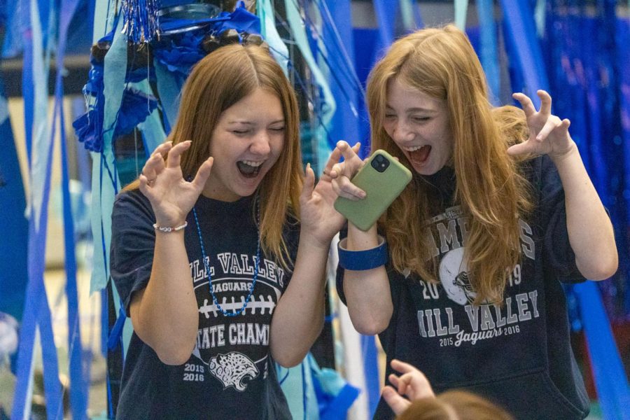 Ready for their picture to be taken, seniors Lauryn Daly and Sienna DelBorrell hold up their hands in claw shapes. 