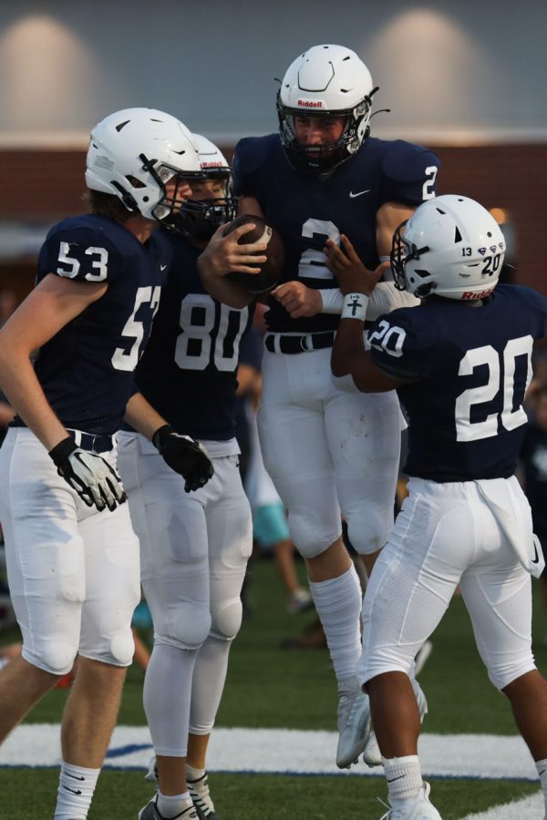 Alongside his teammates, senior Hayden Jay celebrates his first touchdown of the night. 