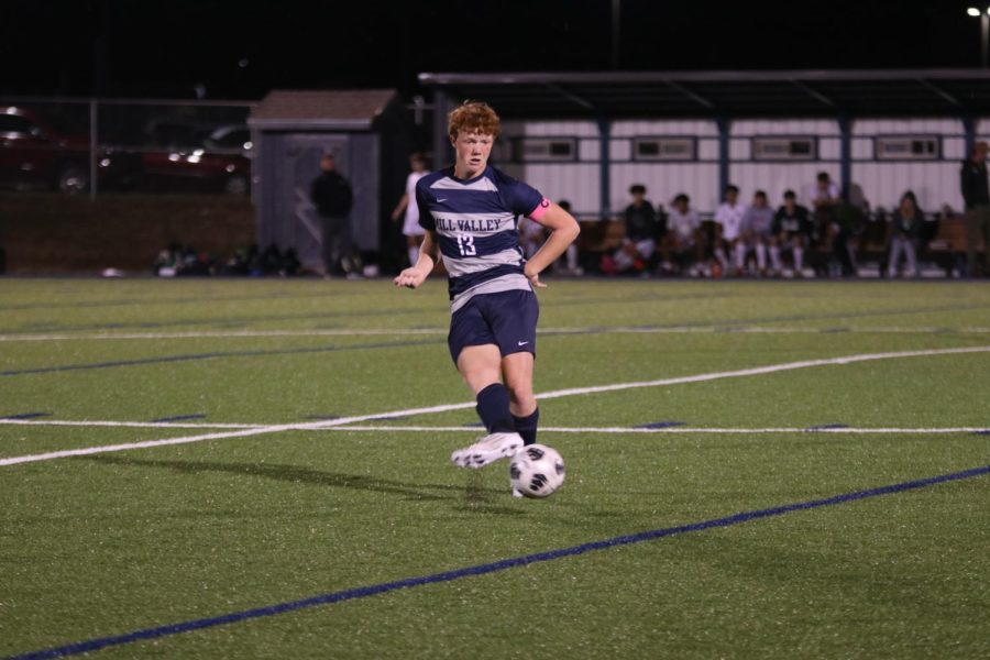 Senior Owen Peachee passes the ball at midfield. 