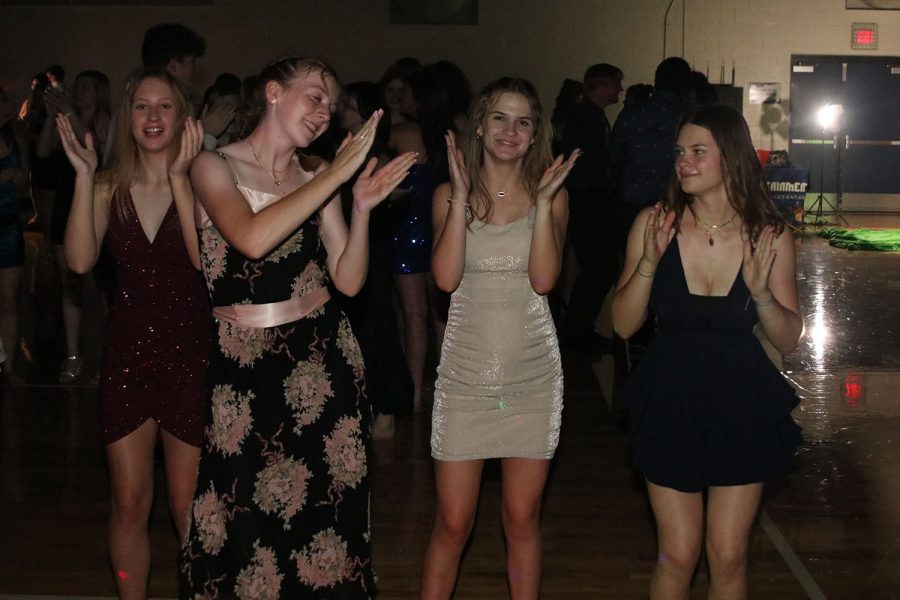 On the dance floor, sophomores Molly Barhorst, Elly Hayes, Emma Ronning and Callen Herman clap along to “The Chicken Dance.”