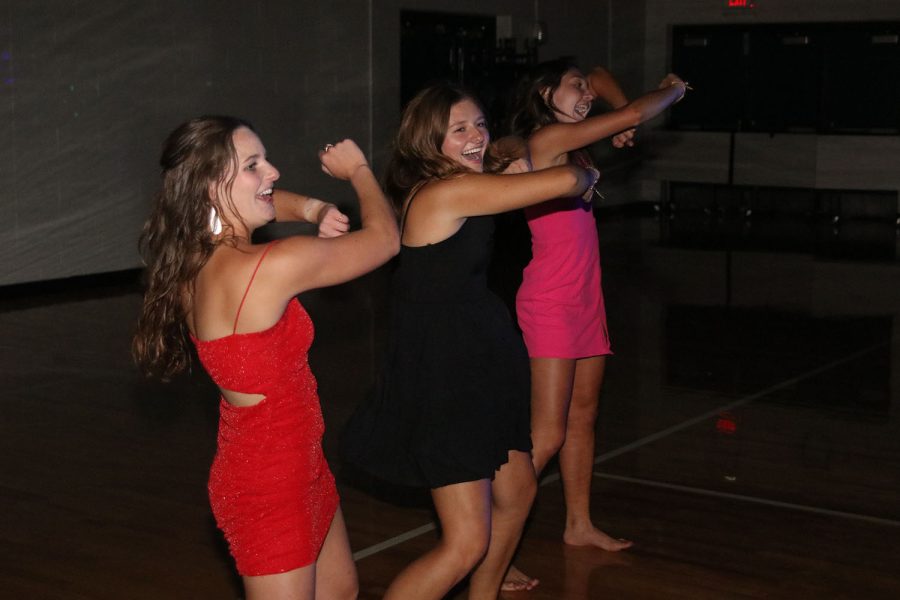 Juniors Ellie Walker, Lucy Roy and Kynley Verdict collectively dance on the dance floor. 