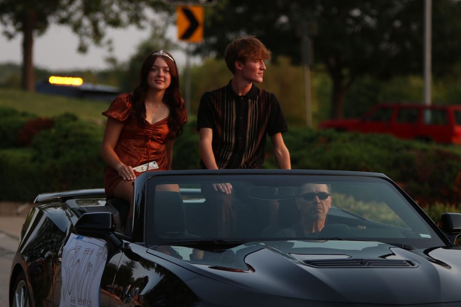 Senior Homecoming candidates Sonny Pentola and Ava Gourd look to the crowd in awe.