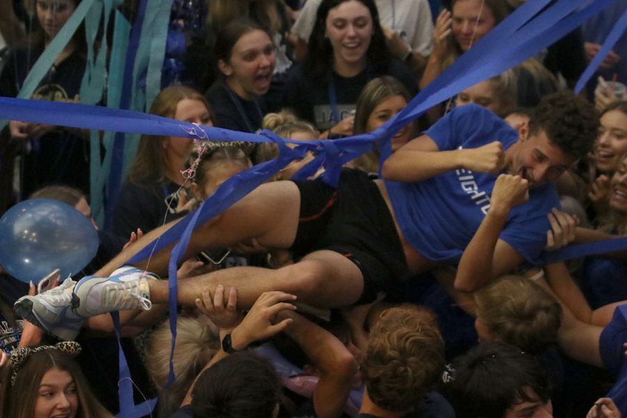 While being held up by his classmates, senior Dylan Ashford crowd surfs.