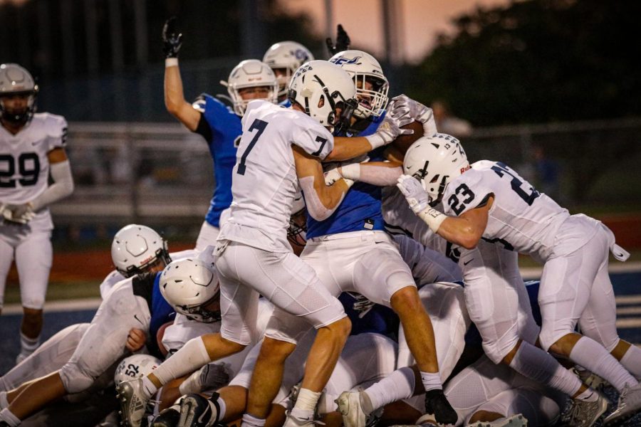 Seniors Mikey Bergeron and Holden Zigmant complete a tackle.