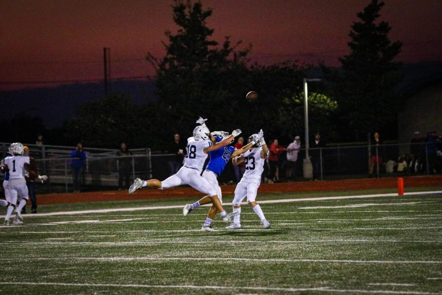 Seniors Holden Zigmant and Broc Worcester intercept a touchdown pass thrown by Gardner-Edgerton.