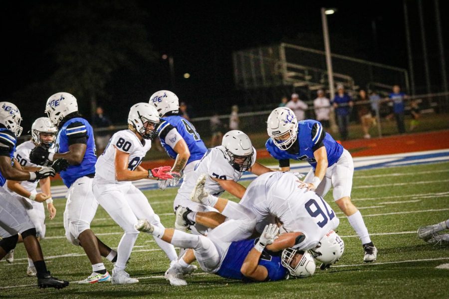 Offensive lineman senior Jack Melvin completes a tackle on Gardener Edgertons player.