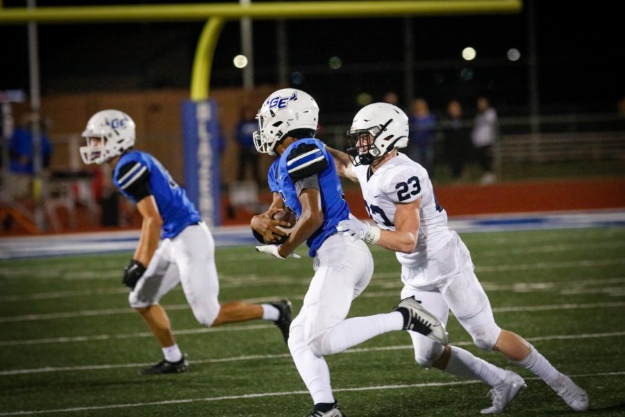 Senior Holden Zigmant attempts to stop Gardner-Edgertons players from reaching the end zone.