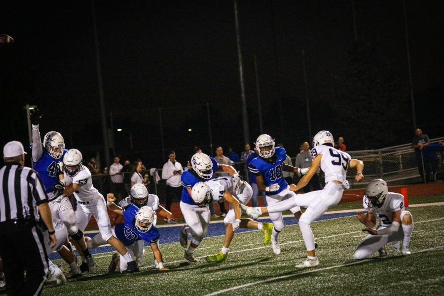 After scoring a touchdown, kicker junior Kenten Laughman successfully kicks a field goal.