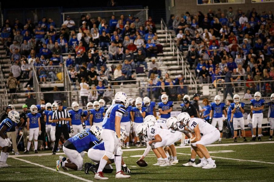 Offensive lineman Ty Marsh gets in the snapping position alongside the rest of offensive, waiting for the play to start.