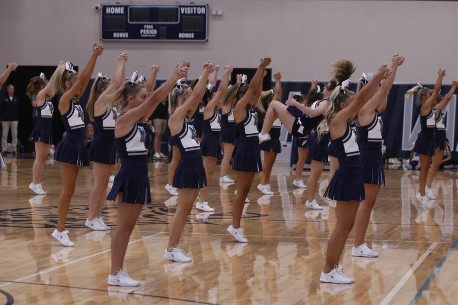 The cheer team performs a routine.