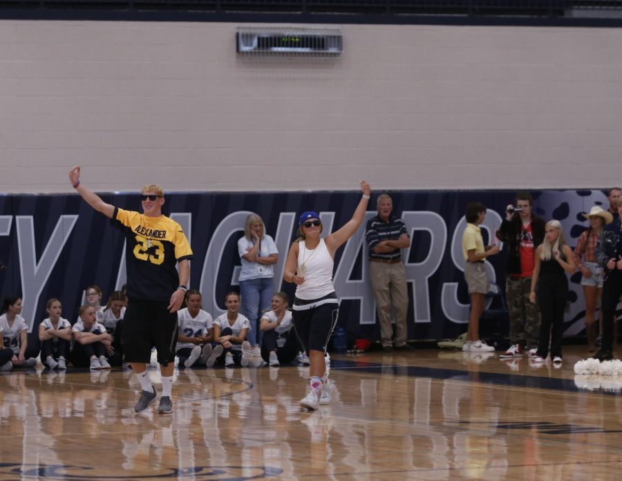 Senior Homecoming candidates Mikey Bergeron and Avery Blubaugh run on the floor as they are introduced.

