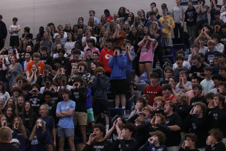 The sophomore student section is cheering loud for their peer Jayden Woods in musical chairs.