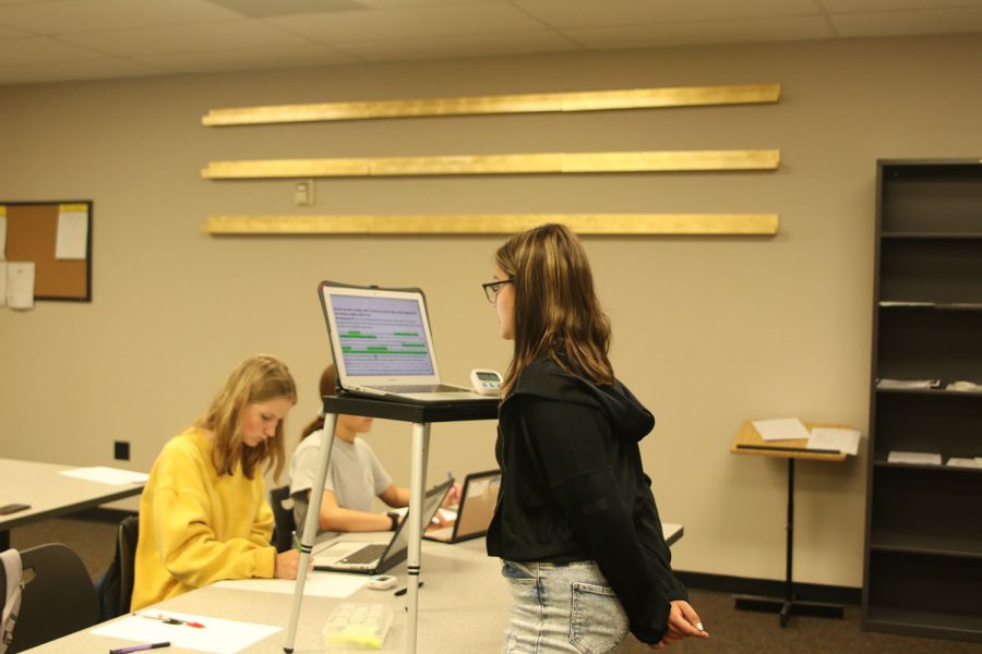 Nearing the end of the affirmative speech, freshman Callyn Ambrose reads from her computer Friday, Sept 23. 
