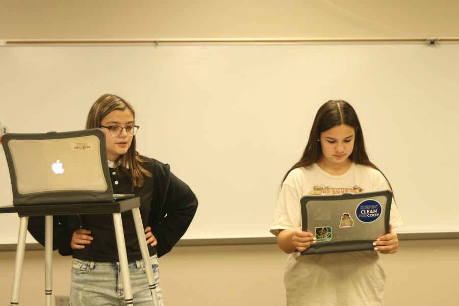 During the cross-examination, freshmen Callyn Ambrose and Lily Suman discuss their arguments Friday, Sept 23. 

