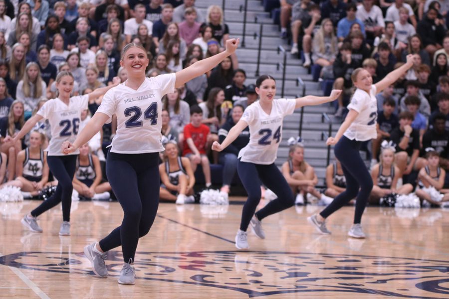 As the Silver Stars perform their dance for the school, junior Halle Wampler stands in front of the team. 