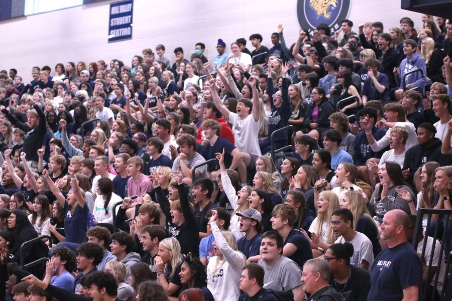 The junior section shows school spirit as their cheer for their representatives in the musical chairs game.