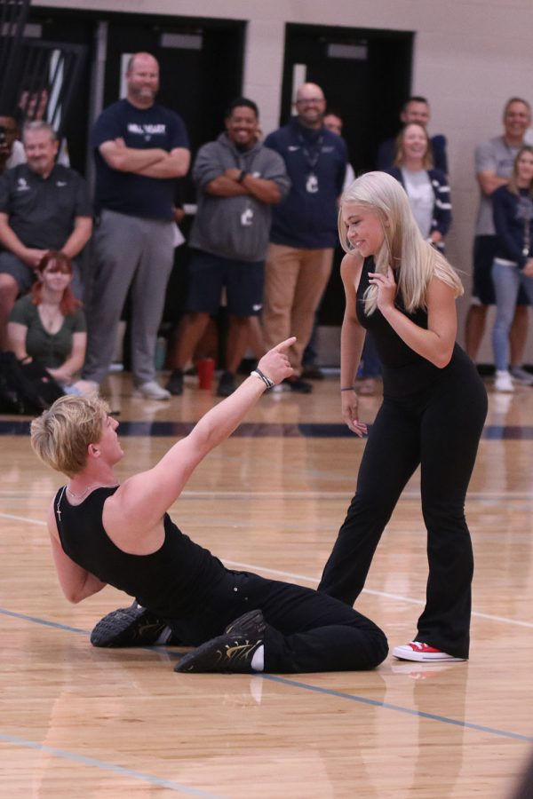 In the midst of their dance, senior Homecoming candidate Hayden Jay slides into his fellow senior Homecoming candidate Brianna Coup.