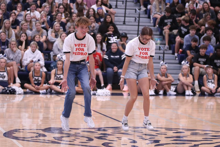 Senior Homecoming candidates Sonny Pentola and Ava Gourd jump in sync as they perform their candidate dance for the judges.
