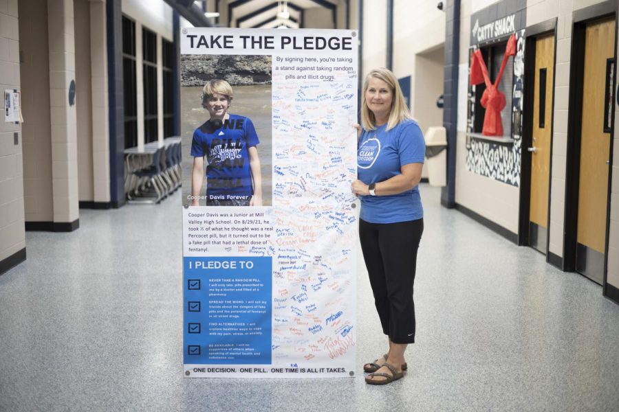 Holding the drug awareness pledge signed by Mill Valley students on Monday, Sept. 12, Libby Davis has spread awareness to the dangers of illicit drugs. Libby says “[the DEAs] campaign is called One Pill Can Kill. We just kind of grabbed on to that statement and we created Keeping Clean For Coop.