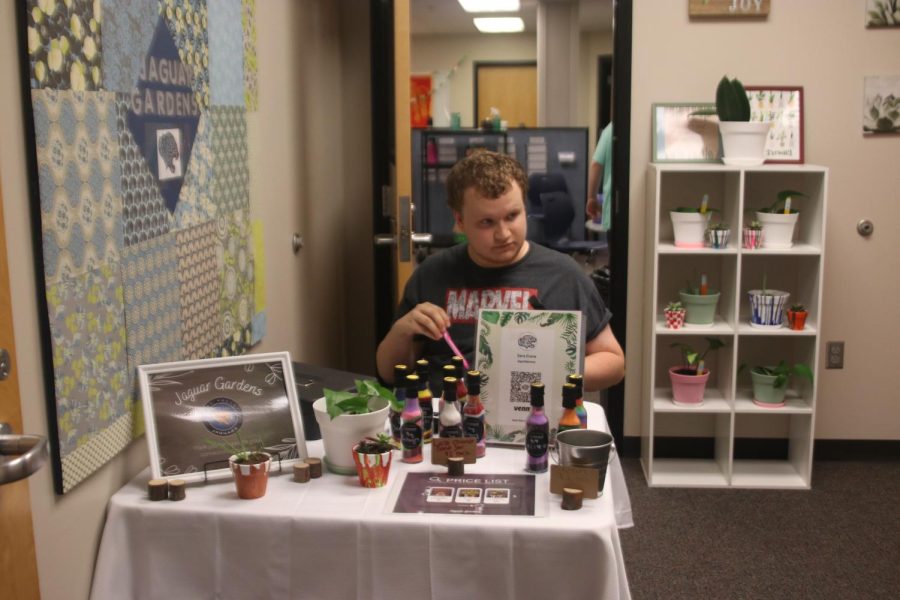 Junior Gus Gosch sells plants Friday, Sept 23. 