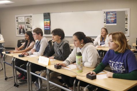 Ready to hit the buzzer, the quiz bowl team prepares for their first round in the tournament. The team hosted a varsity tournament at Mill Valley Wednesday, Oct. 26.