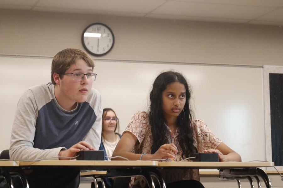 Stating his answer, freshman Ian Weatherman participates in the competition.