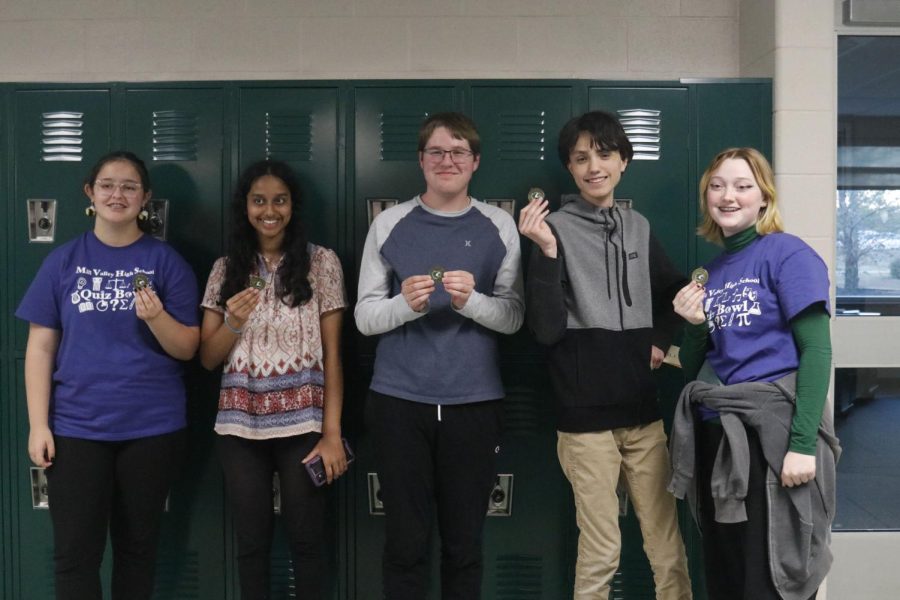 After winning first place, the quiz bowl team poses for a picture.