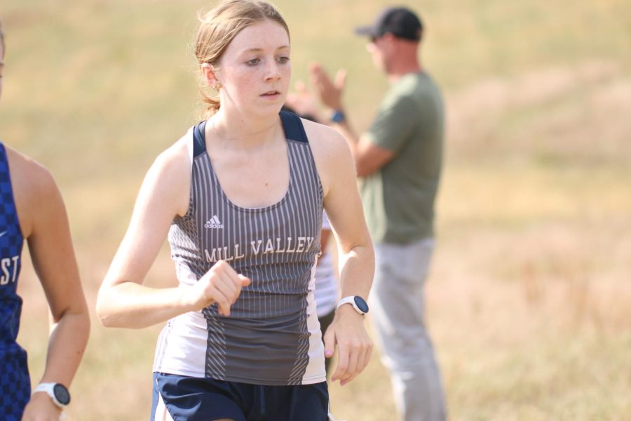 Starting the race, sophomore Elly Hayes begins to run at Shawnee Mission Park.