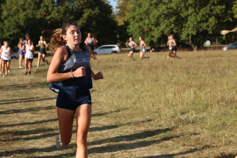 Junior Kynley Verdict runs at the cross country meet.