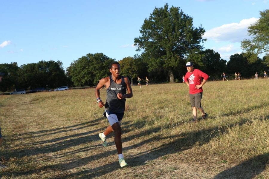 Going around a bend, junior AJ Vega runs the 5K.