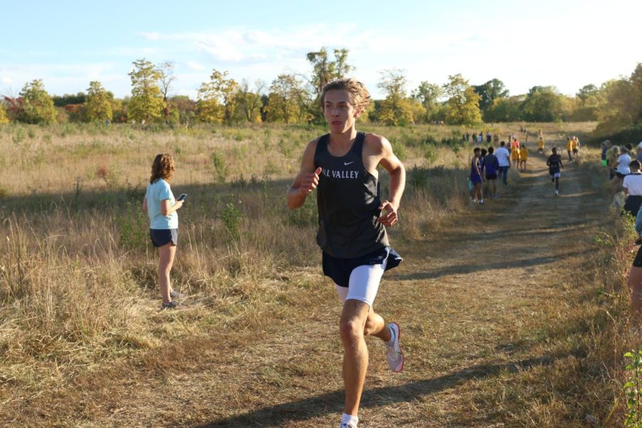 Determined, sophomore Carter Cline runs steadily.
