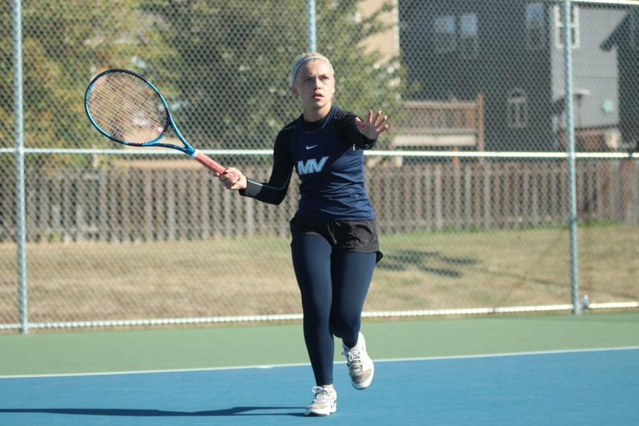 Preparing for her next strike, senior Bri Coup concentrates on the ball.