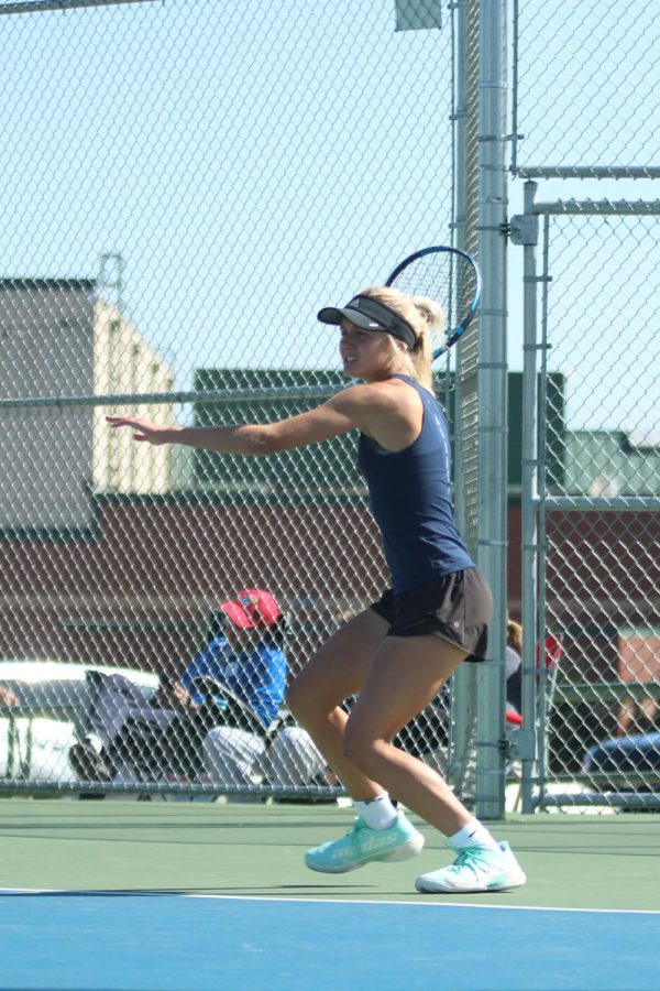 Focused on the ball, senior Skylar Szoke prepares to strike the ball.