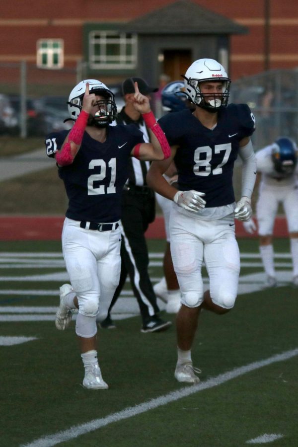 Junior Tristan Baker points towards the sky after scoring a touchdown.