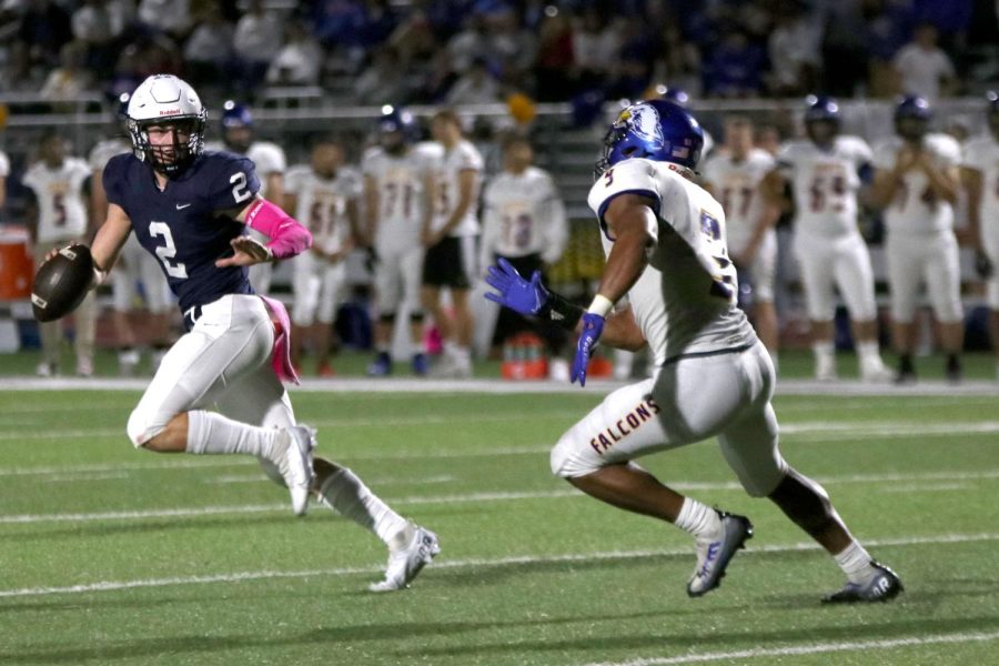 Running from the tackle, senior Hayden Jay looks for an open receiver.