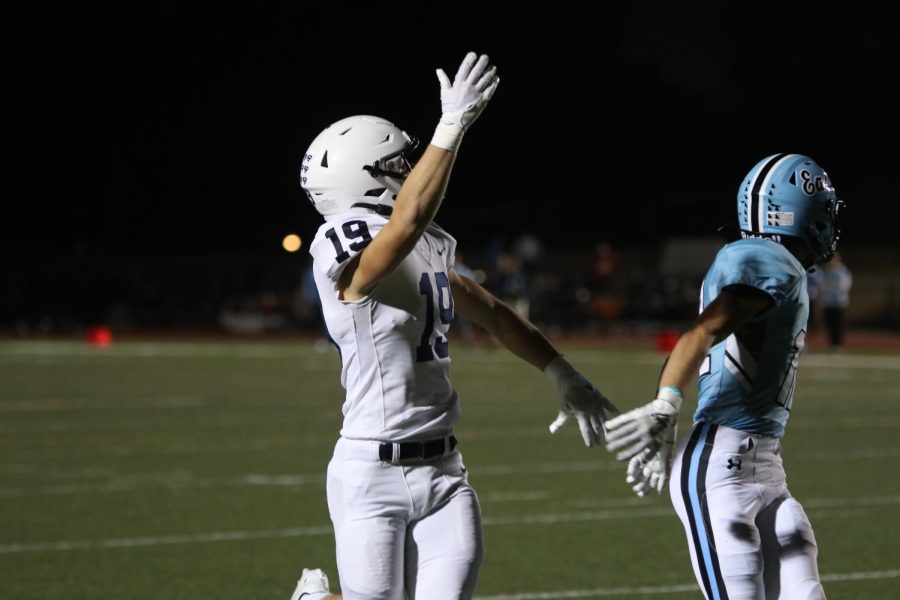 Senior Hayes Miller raises his arm for a pass.