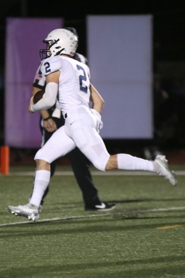 Senior Hayden Jay runs the ball to the endzone for a touchdown.