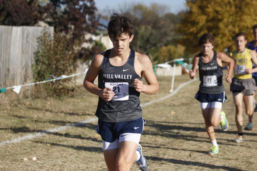 Focused on the race, senior Lucas Robins keeps a steady pace.
