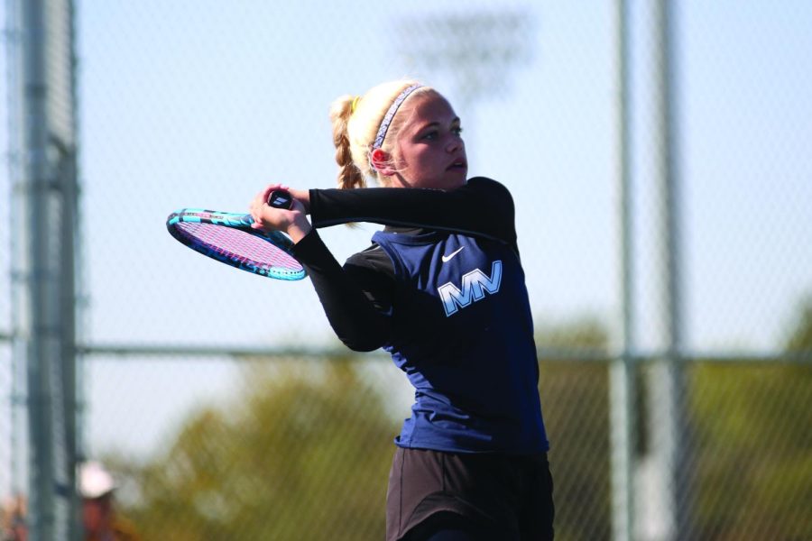With great speed, senior Bri Coup prepares to swing her racket. 