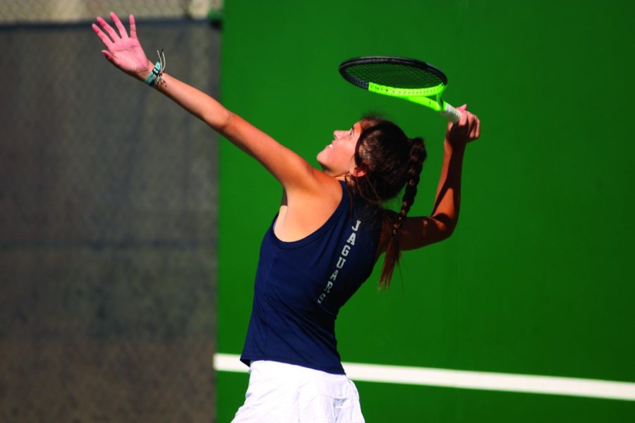 While her and partner junior Sofia Steinmetz, are in the lead, junior Emily Stove serves again. 