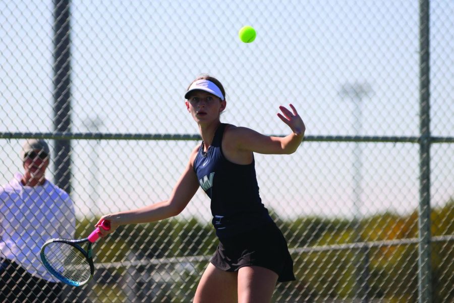 Focusing, junior Sofia Steinmetz returns the ball from her opponent. 