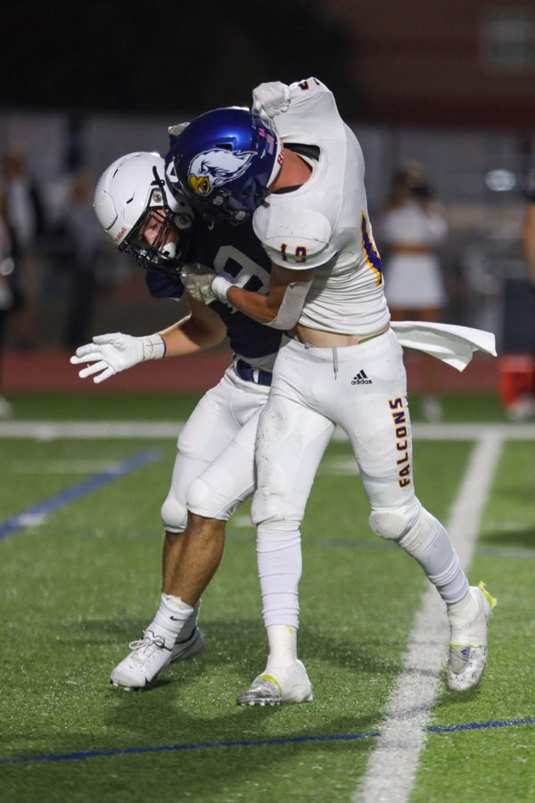 In an attempt to get further down the field, senior Hayes Miller pushes past the opposing player.